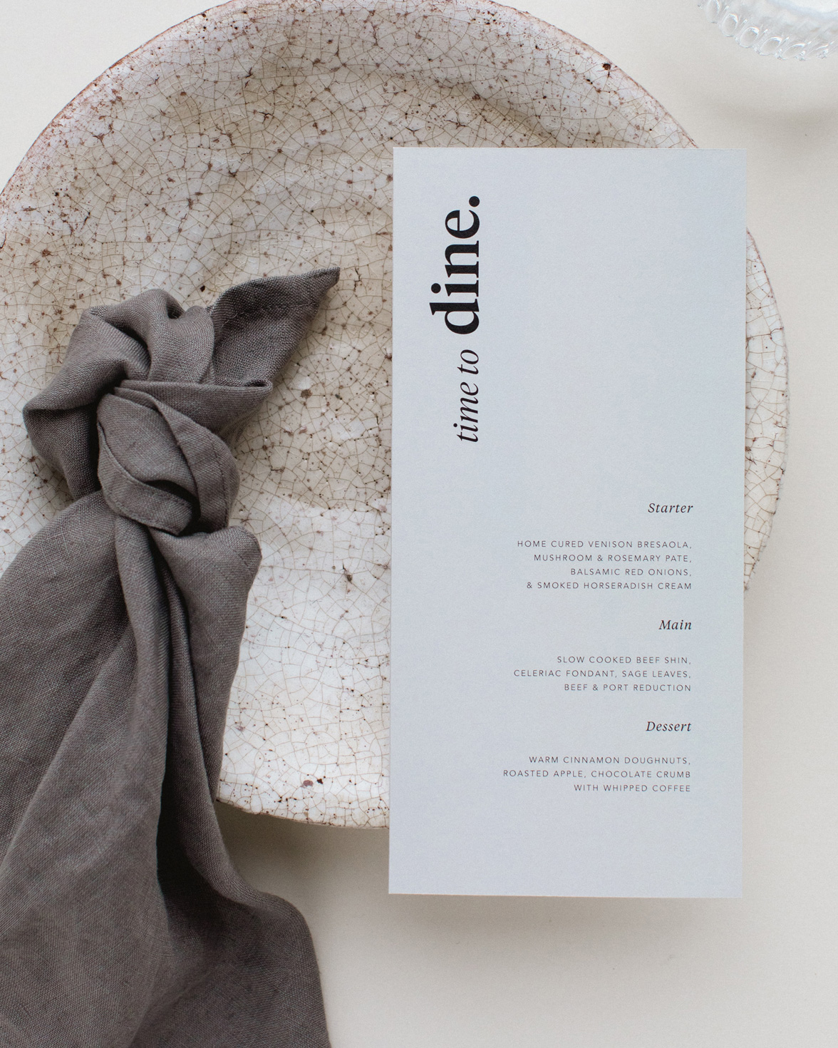 Duly Noted wedding menu in grey with bold black typography