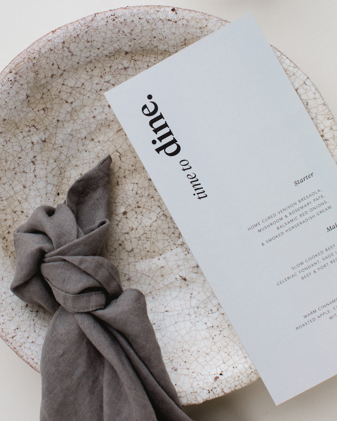 Duly Noted wedding menu in grey with bold black typography