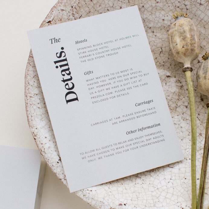 Duly Noted wedding details card in grey with bold black typography