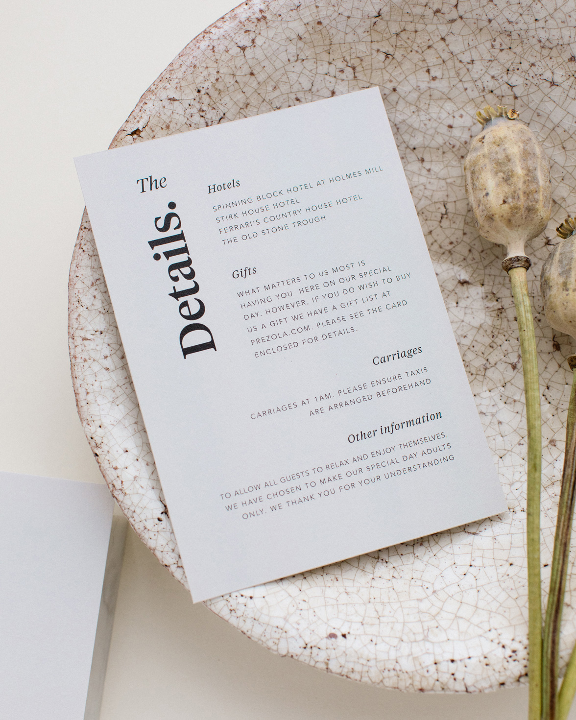 Duly Noted wedding details card in grey with bold black typography