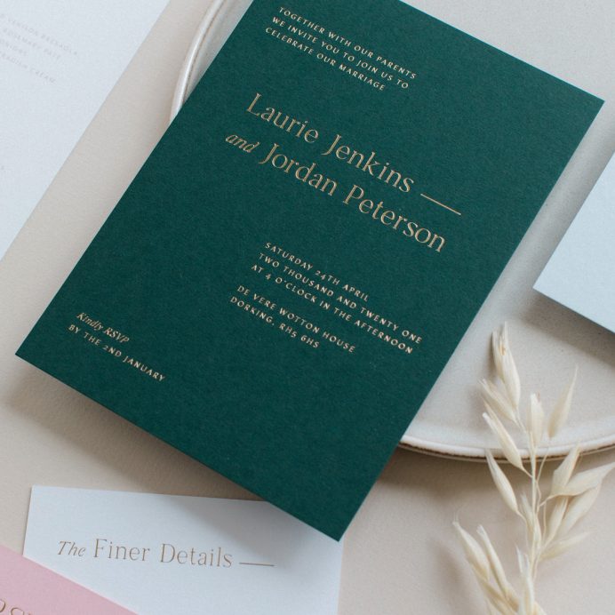 Refined gold wedding invitation in racing green with gold foil print