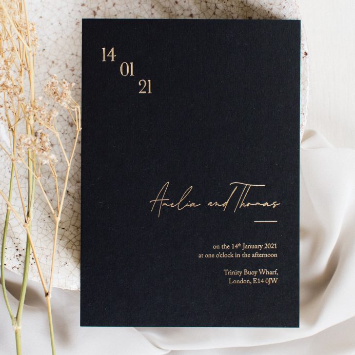 Simply Harmony wedding invitation. Black invitation with gold foil
