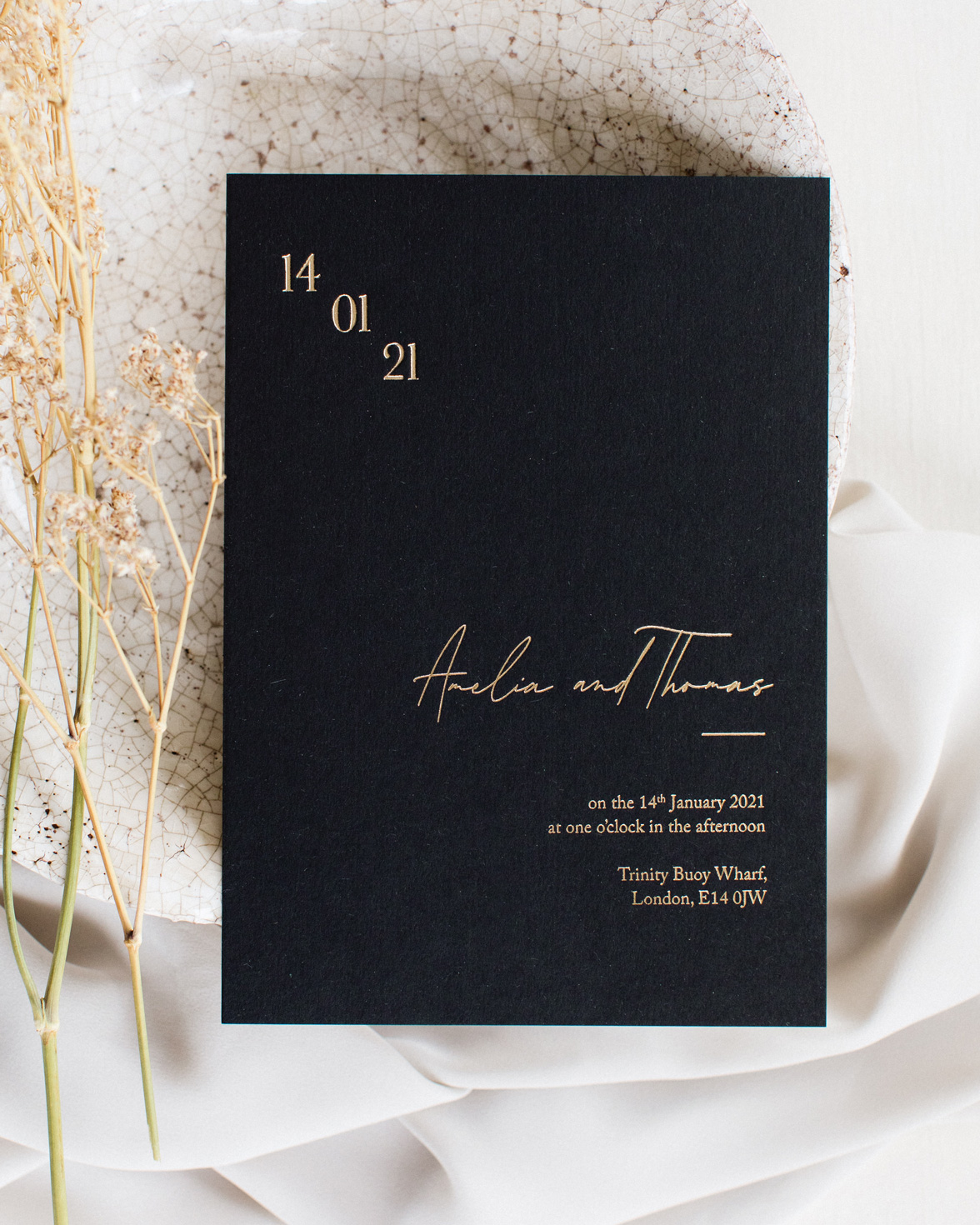Simply Harmony wedding invitation. Black invitation with gold foil