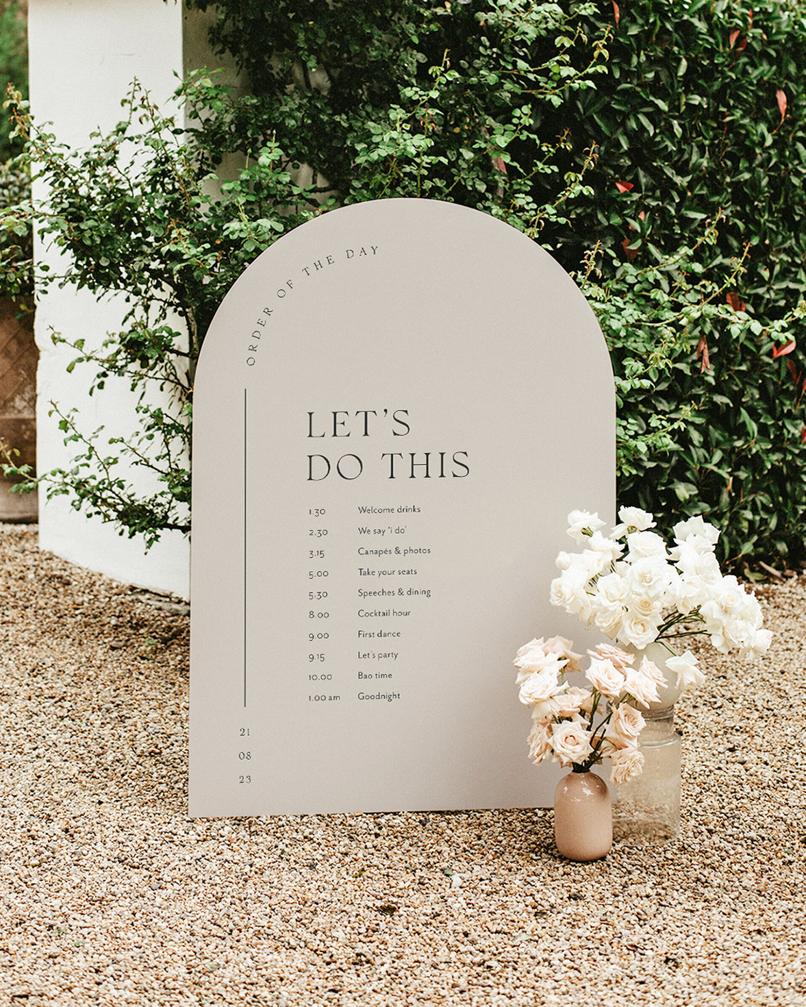 Arched wedding order of the day sign