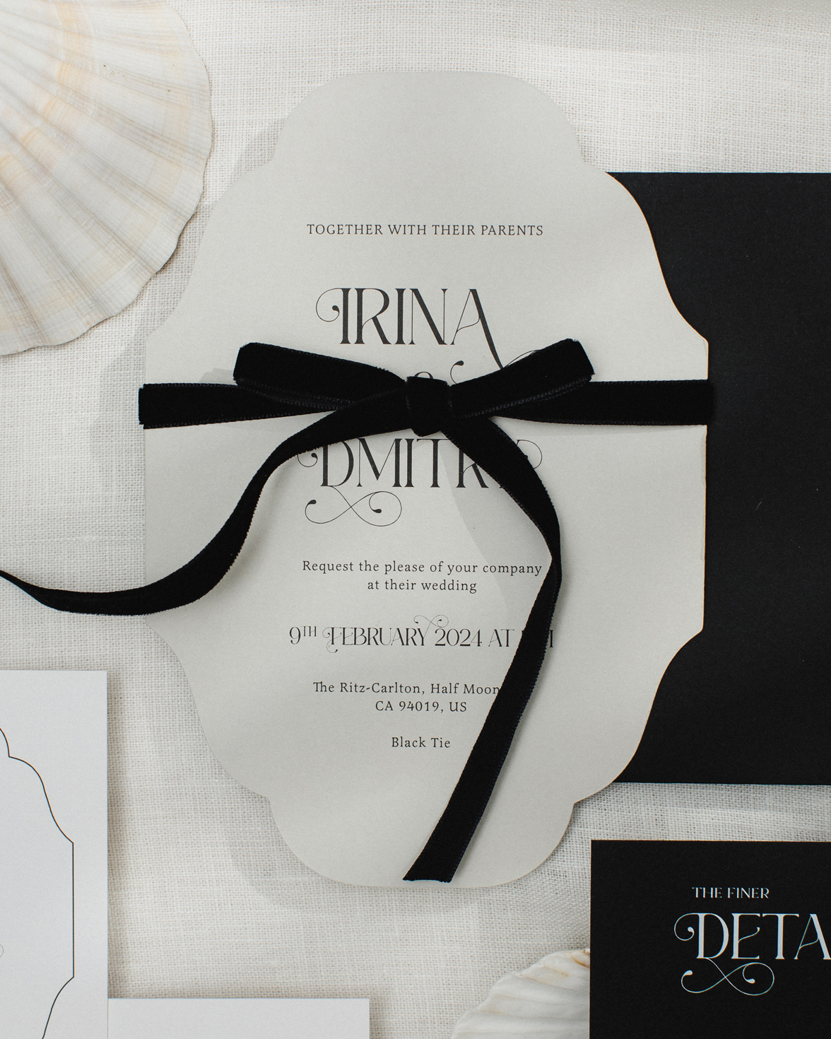 Vintage inspired cut to shape wedding invitation with ornate font and black velvet bow