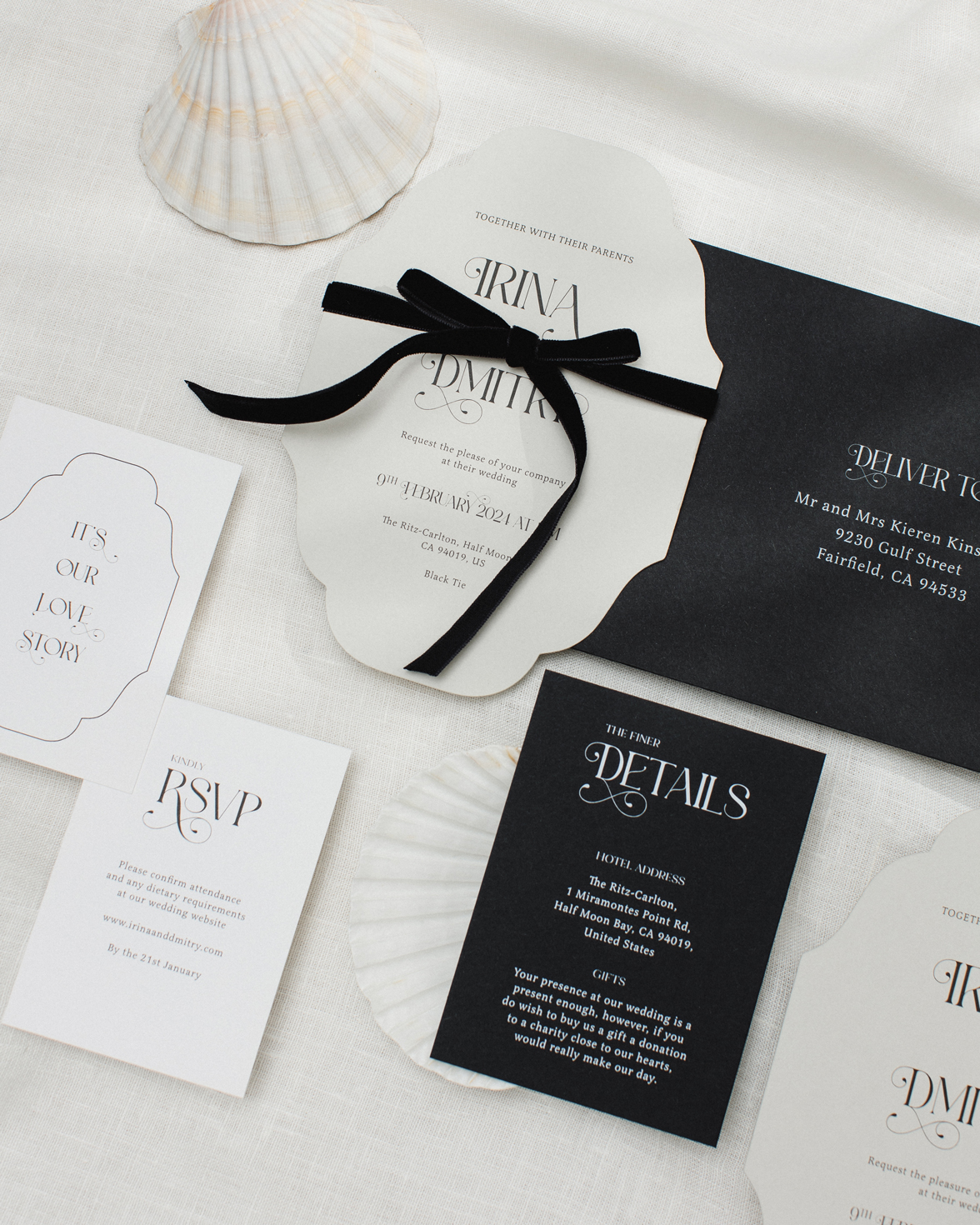 Vintage inspired cut to shape wedding invitation with ornate font and black velvet bow. White RSVP card with vintage border.Black and white wedding details card