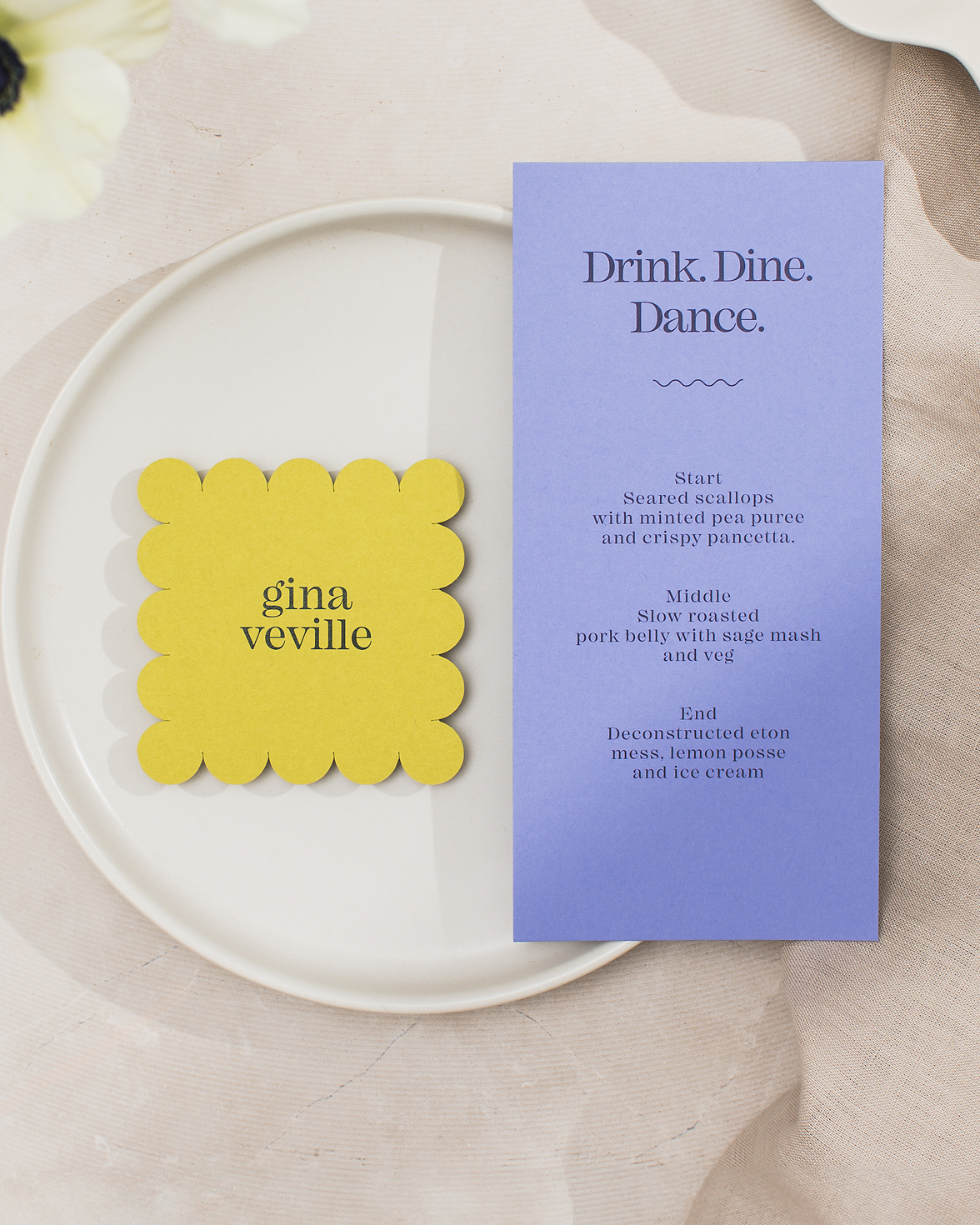 Purple wedding menu with drink, dine, dance typography. Citrus green scalloped edge wedding name card
