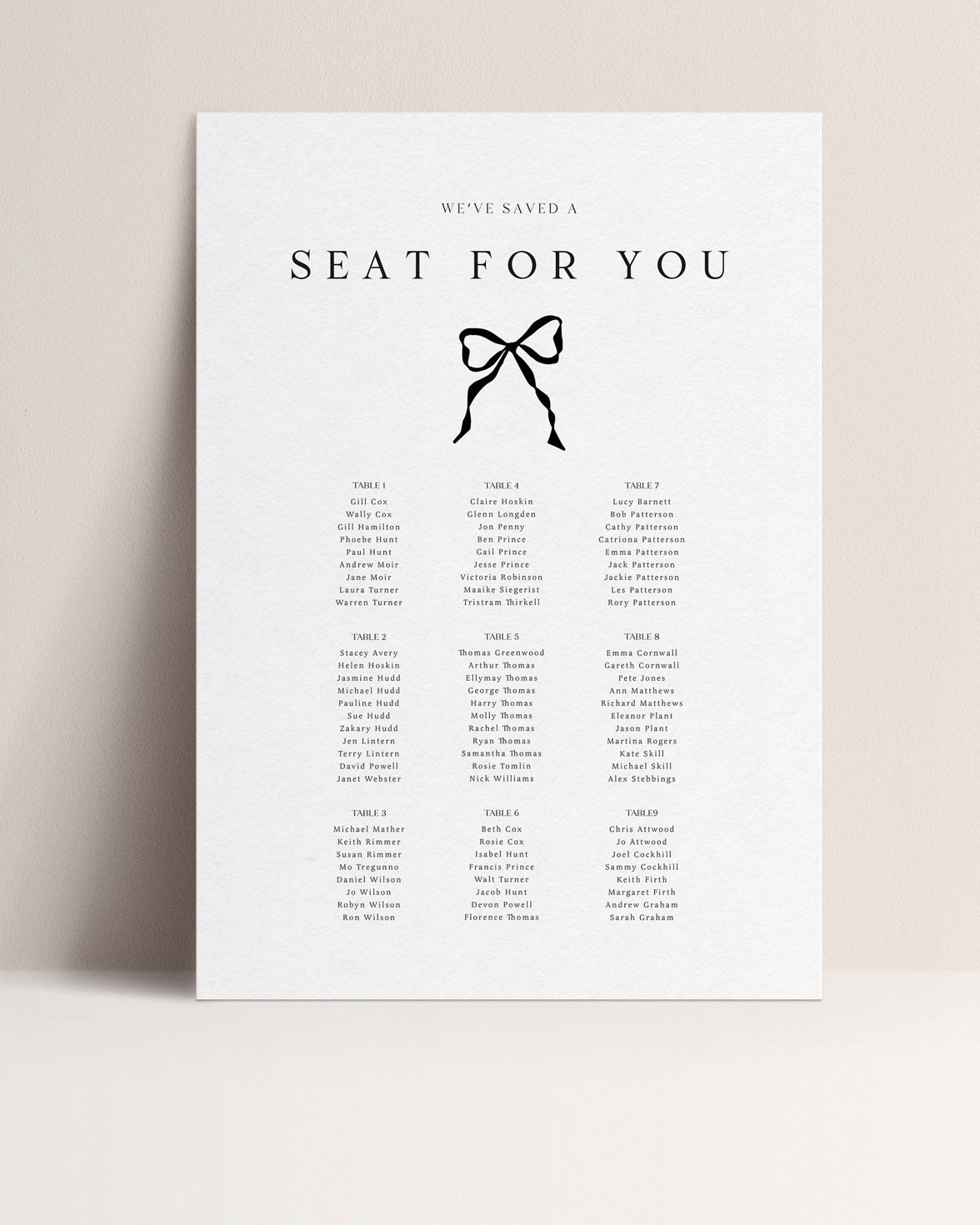 Black and white wedding table plan with black hand drawn bow