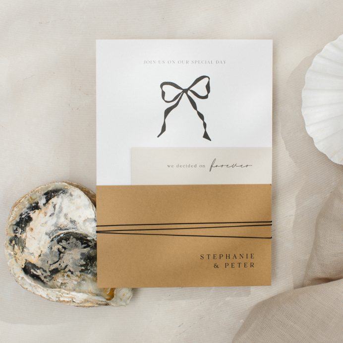 Black and white wedding invitation with bow. Mustard colour RSVP tied together with twine