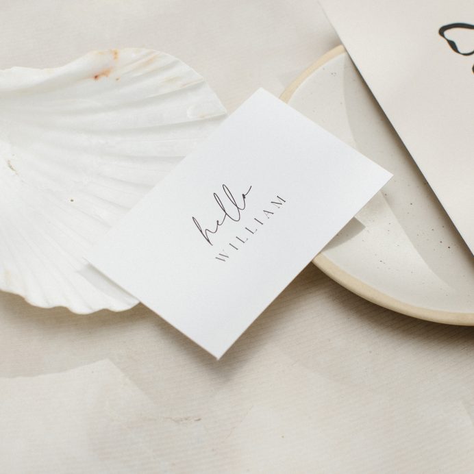 White flat rectangle place card with script font