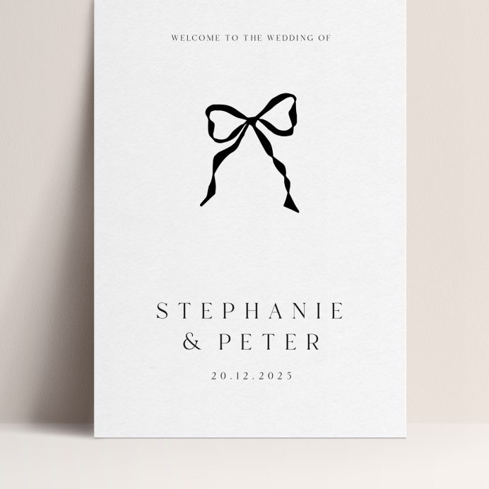 Black and white wedding welcome sign with black handdrawn bow