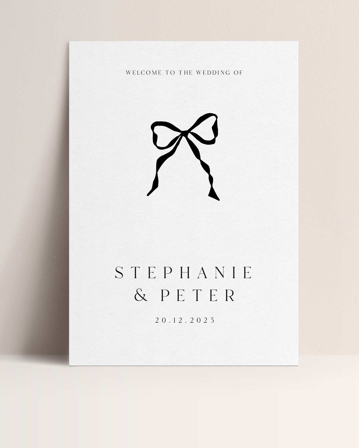 Black and white wedding welcome sign with black handdrawn bow