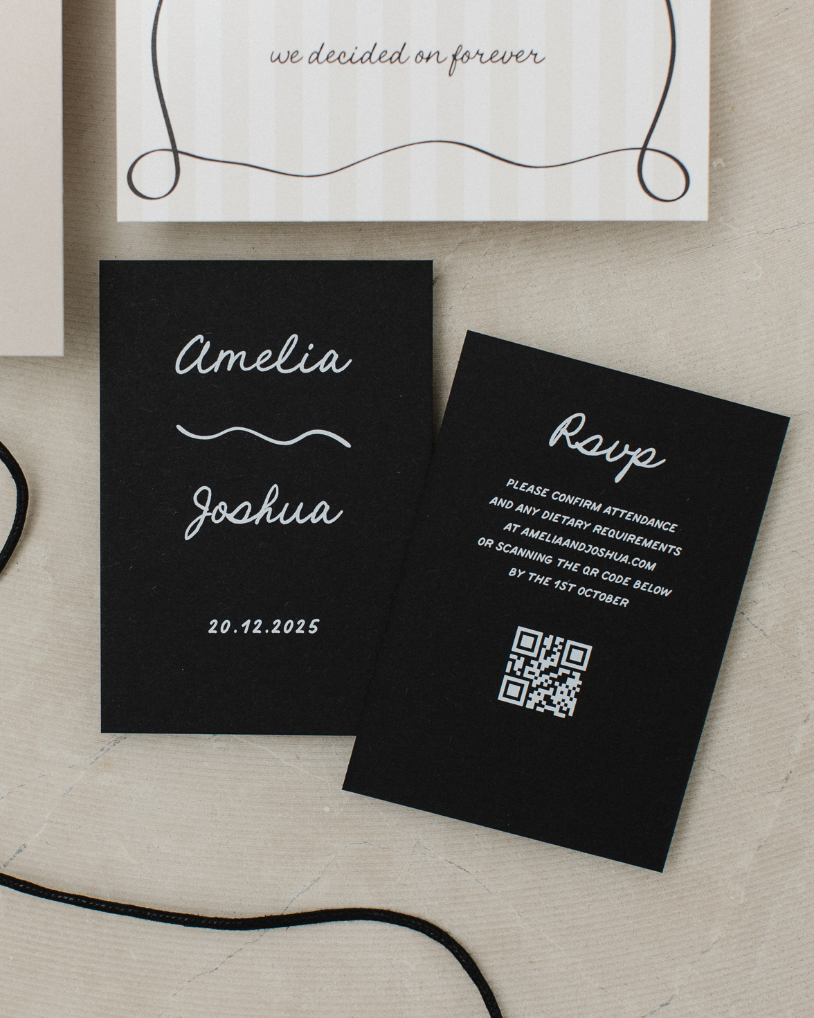 Black wedding RSVP card with white ink and QR code and squiggly line
