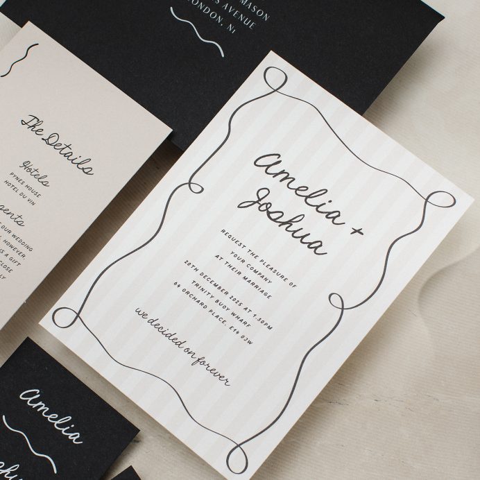 Tonal stripe wedding invitation with squiggly border and hand drawn font. Black envelope addressed with white ink