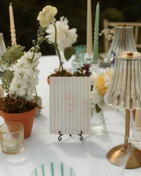 Striped wedding table numbers, with pink script writing